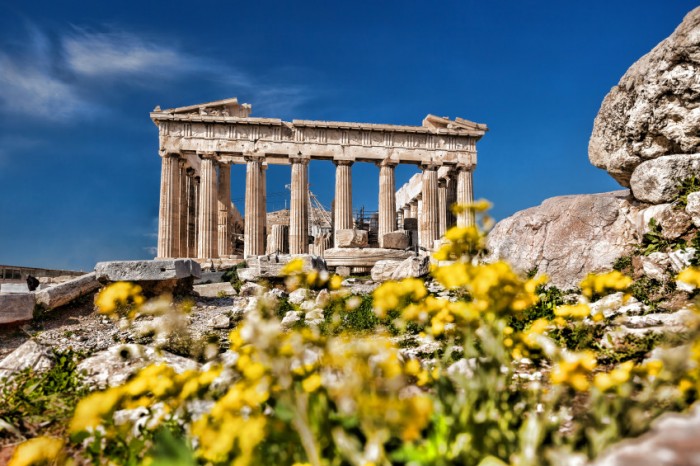 Imagine you are narrating a guided tour throughout the ancient Greek and Roman worlds.